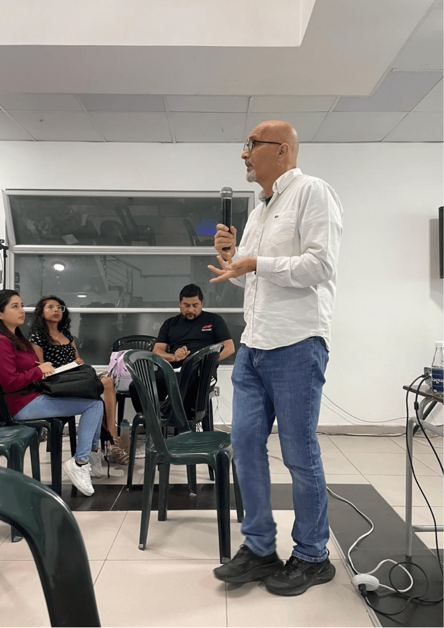Chaz facilitating a workshop with a diverse group of professionals